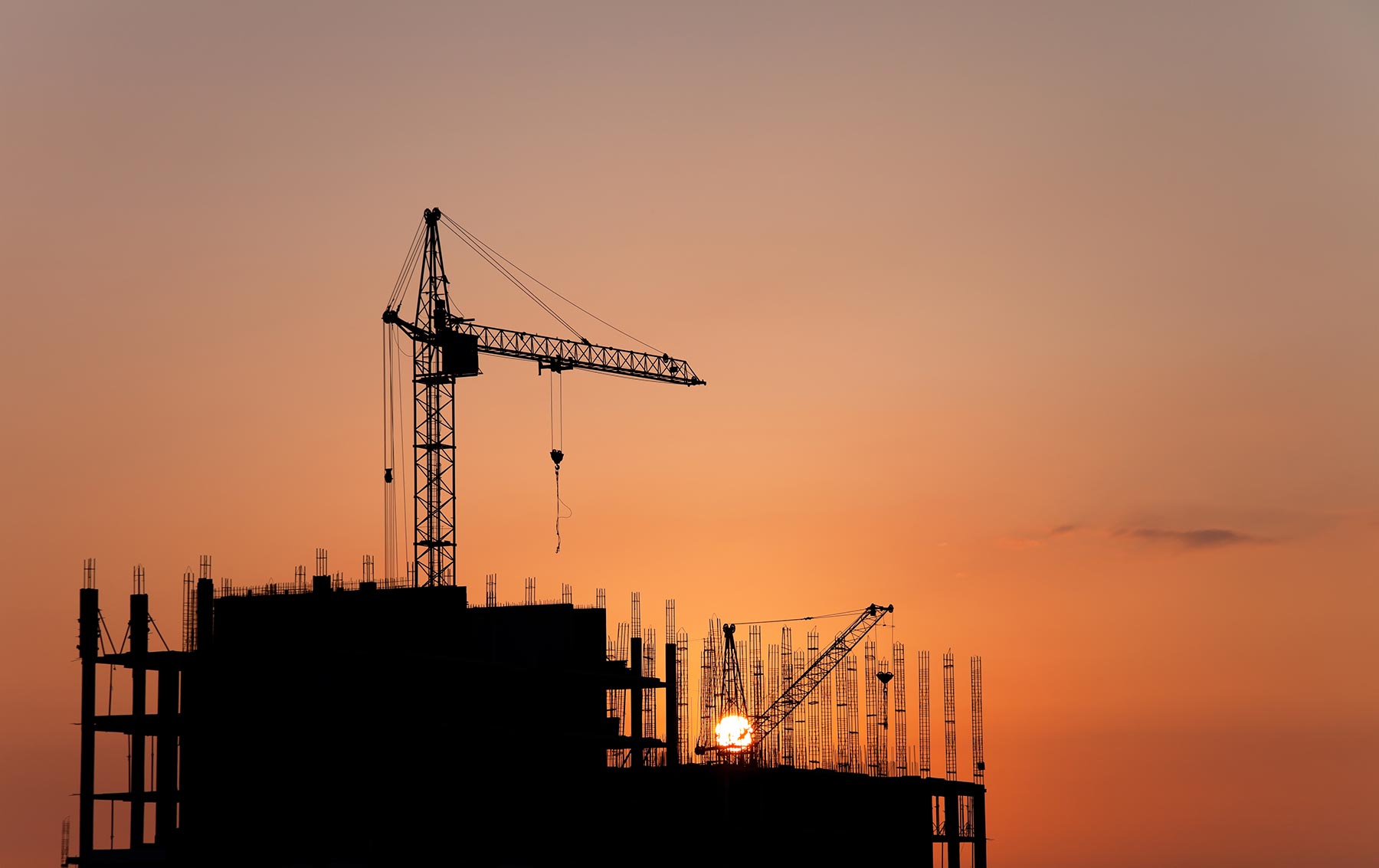 construction-cranes-and-concrete-structure-at-suns-PBLEVC8.jpg